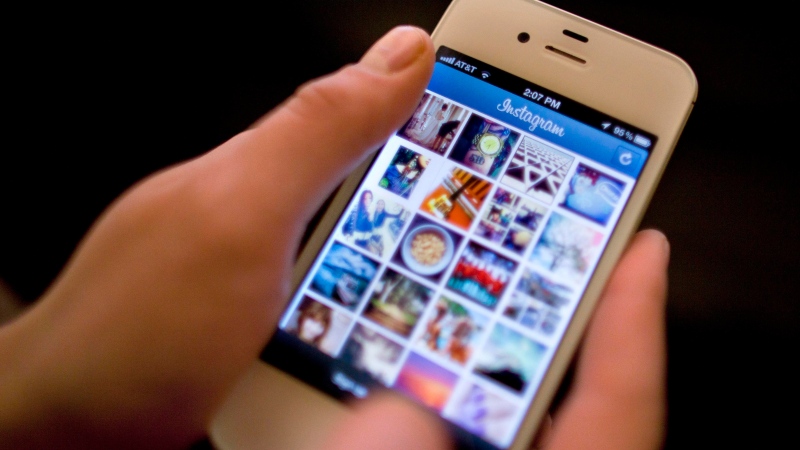 This April 9, 2012, file photo shows Instagram being demonstrated on an iPhone in New York. (Karly Domb Sadof/AP)