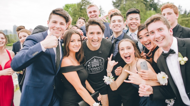 Prime Minister Justin Trudeau jogging by teens