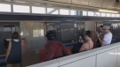 Smoke pours out of a SkyTrain car following an incident at Scott Road Station in Surrey, B.C. (Twitter/Aaron Maharaj) 
