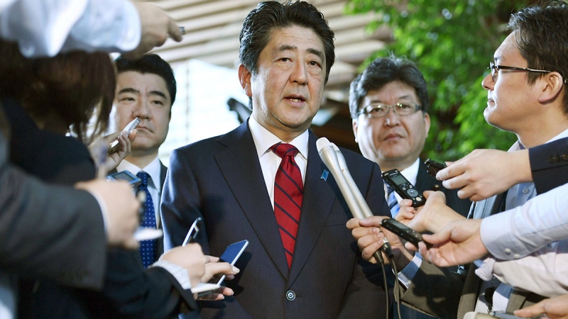 Japanese Prime Minister Shinzo Abe, center, answers to a reporter's question about North Korea's missile launch, at his official residence in Tokyo Monday morning, May 29, 2017. (Muneyuki Tomari/Kyodo News via AP)