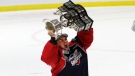 Michael DiPietro hoists the Memorial Cup after the Windsor Spitfires defeated the Erie Otters in the final of the 2017 Mastercard Memorial Cup in Windsor, Ont., on Sunday, May 28, 2017. (Melanie Borrelli / CTV Windsor)