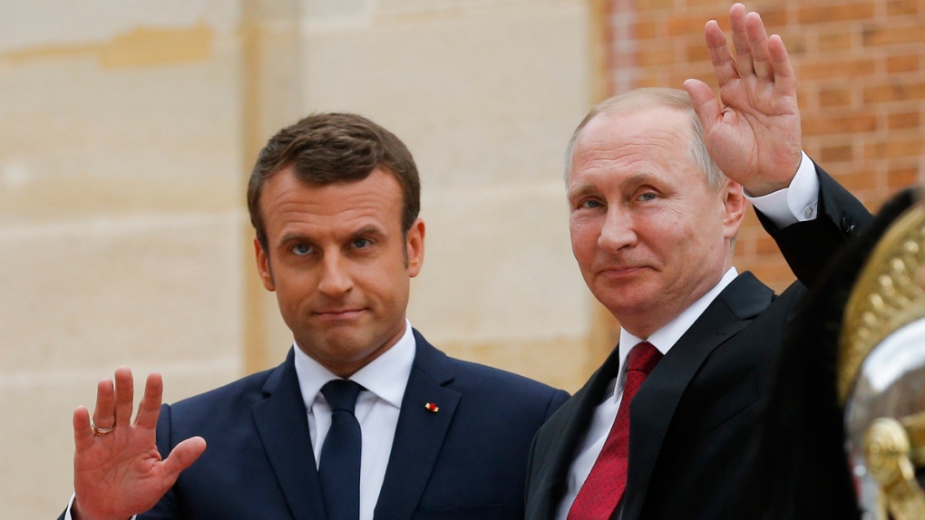 Vladimir Putin, right, and Emmanuel Macron
