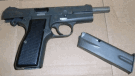 A firearm that was seized during the execution of a search warrant on May 31 is shown. Samuel Elvira, 23, is facing 16 charges in connection with a home invasion investigation.