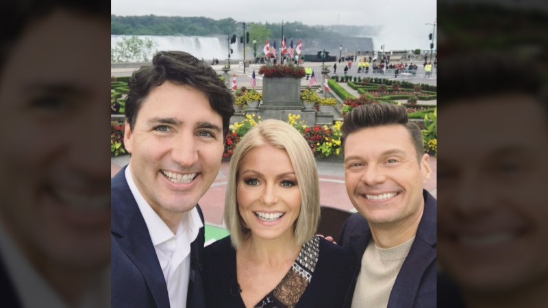 Justin Trudeau is shown with Kelly Ripa and Ryan Seacrest in a selfie taken during filming of 'Live with Kelly and Ryan,' in Niagara Falls, Ont., on June 5, 2017. (Live with Kelly and Ryan / Twitter)