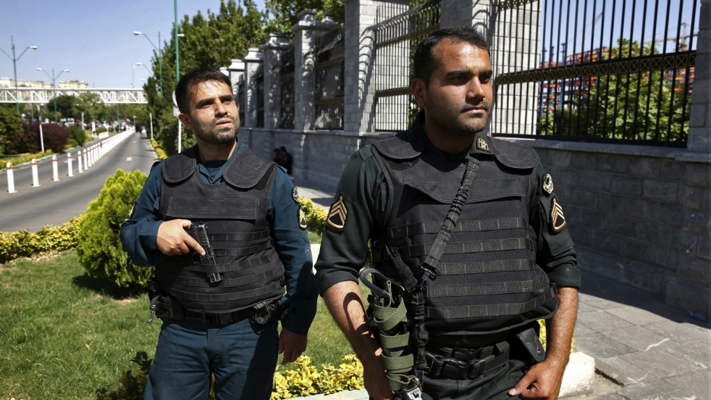 Police outside Iran's parliament