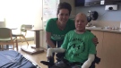 Tina Boileau is seen with her son, Jonathan Pitre, in a Minneapolis hospital. (Twitter: Tina Boileau)