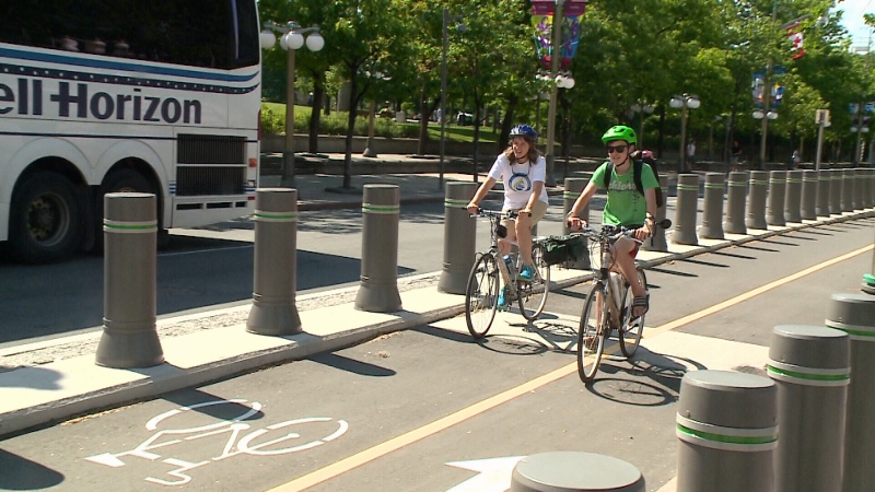Cyclists take the new MacKenzie Avenue bike Lane for a spin on June 9, 1017.