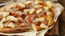 Hawaiian pizza is seen in this stock photo. (LauriPatterson / Istock.com)