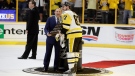 Pittsburgh Penguins' Sidney Crosby (87) accepts the Conn Smythe Trophy from NHL commissioner Gary Bettman after Game 6 of the NHL hockey Stanley Cup Final against the Nashville Predators, Sunday, June 11, 2017, in Nashville, Tenn. (AP Photo/Mark Humphrey)