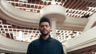 The Weeknd stands inside the Toronto Reference Library in his 'Secrets' music video. (TheWeekndVEVO/YouTube)