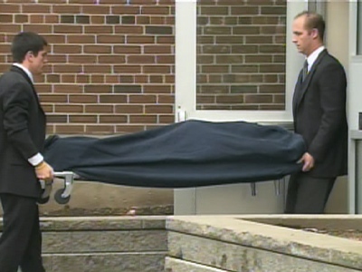 The body of the deceased woman is removed from her Eppleworth Road home on Thursday, April 2, 2009.