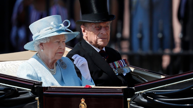 Queen Elizabeth II and The Duke of Edinburgh leave Buckingham Palace in a carriage, to attend the annual Trooping the Colour Ceremony in London, Saturday, June 17, 2017. (AP / Kirsty Wigglesworth)