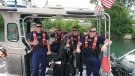 Members of Coast Guard Station St. Clair Shores aboard their response boat after saving a woman's life in Lake St. Clair.
(Photo courtesy of U.S. Coast Guard photo by Petty Officer 2nd Class Robert Lietaert.) 