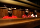 Sifiso Mhlanga, Julius Gxowa and Mbuti Mabe, await sentencing in the Johannesburg high Court Thursday, April, 2, 2009. (AP) 