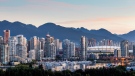 Vancouver's skyline at sunrise is shown in this undated handout photo. Vancouver has been placed on travel site Lonely Planet's top ten list of cities to visit in 2020. (Destination BC/Albert Normandin via The Canadian Press)