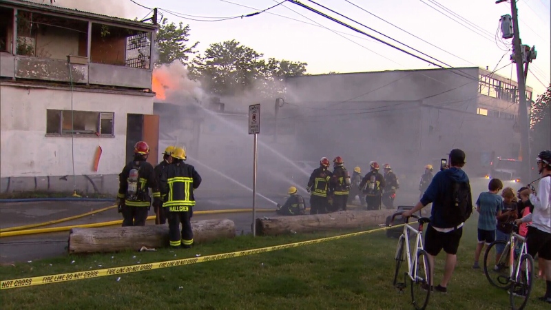 Firefighters  battle a blaze that destroyed six businesses and a home in Vancouver's Kerrisdale neighbourhood. June 22, 2017. (CTV)