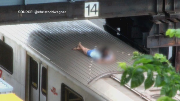 Girl hangs out on TTC train roof
