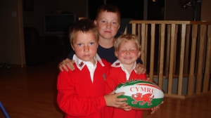 Sean, Blake and Lyndon Arnal pose with a rugby ball in this undated family photo. (SUBMITTED/ARNAL FAMILY)