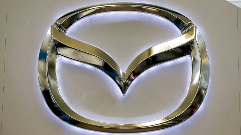 This Feb. 14, 2013, file photo, shows the Mazda logo on a sign at the 2013 Pittsburgh Auto Show, in Pittsburgh. (AP Photo/Gene J. Puskar, File)