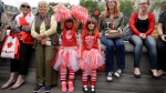 Girls of Canadian heritage who live in Banbury, England, pose for photographs during a 'Canada 150' celebration in Trafalgar Square, London, Saturday, July 1, 2017. Saturday is Canada Day, and this year marks the country's national milestone of 150 years since Confederation. (AP Photo / Matt Dunham)