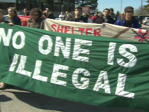 Dozens rallied Sunday to protest the detention of migrant workers.
