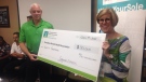 Ground Effects CEO Jim Scott presented a $30,000 cheque to local CMHA CEO Claudia Den Boer Grima, on Thursday, July 19, 2017. (Bob Bellacicco / CTV Windsor)