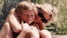 In this photo made available by Kensington Palace from the personal photo album of the late Diana, Princess of Wales, shows the princess and Prince Harry on holiday, and features in the new ITV documentary 'Diana, Our Mother: Her Life and Legacy.' (The Duke of Cambridge and Prince Harry / Kensington Palace via AP) 