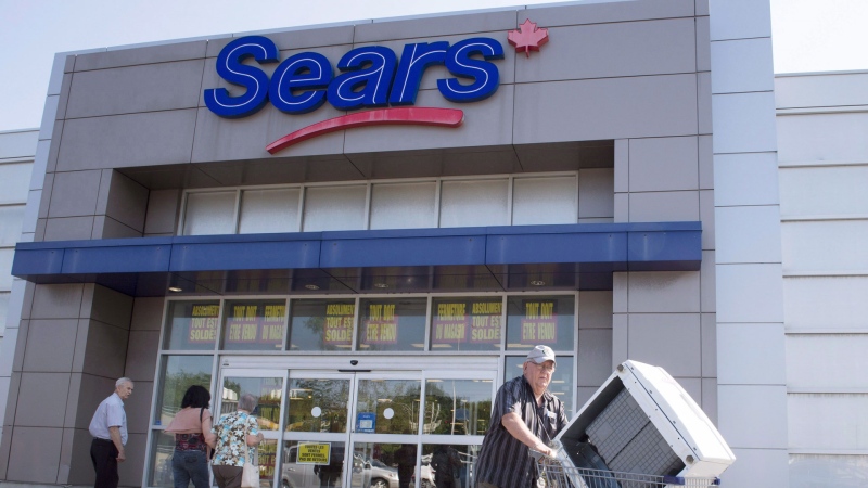 Bargain hunters are seen at the Sears store Friday, July 21, 2017 in St. Eustache, Quebec. THE CANADIAN PRESS/Ryan Remiorz