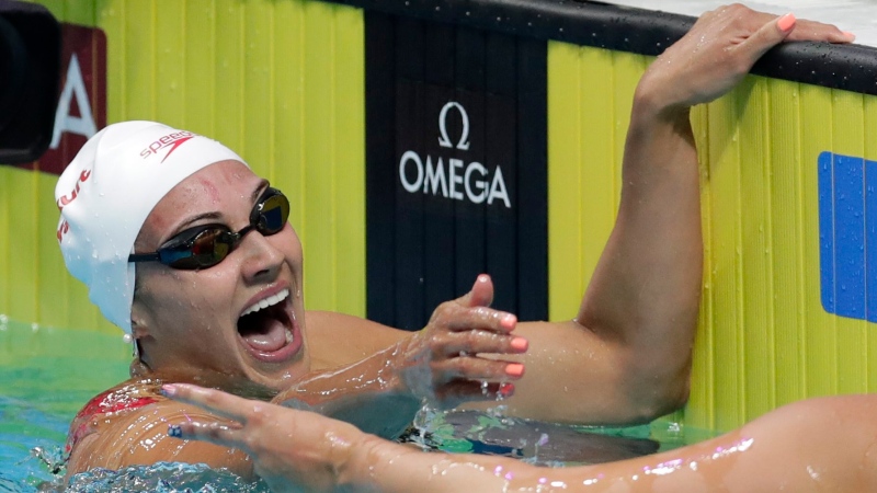 Canada's gold medal winner Kylie Jacqueline Masse celebrates after setting a new world record in the women's 100-meter backstroke final during the swimming competitions of the World Aquatics Championships in Budapest, Hungary, Tuesday, July 25, 2017. (AP / Michael Sohn)