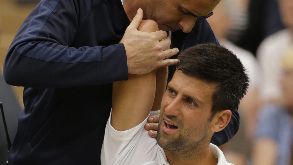 Novak Djokovic receives treatment at Wimbledon