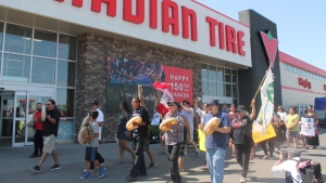 Demonstrators gathered at the Canadian Tire in east Regina two days after an alleged assault was captured on camera in the store. (CTV News / Karyn Mulcahy)