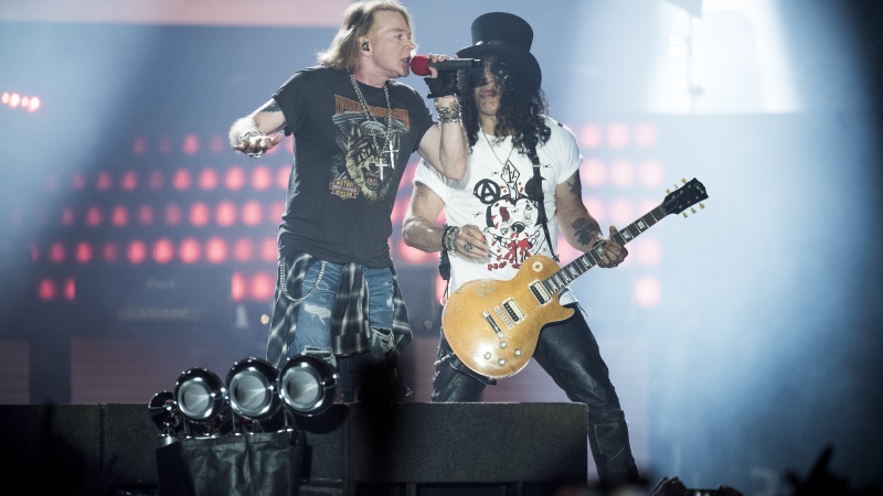 Axl Rose (L), lead singer of the U.S. rock band Guns N' Roses, performs with Slash at Parken Stadium, Copenhagen, Denmark, June 27, 2017. (Mads Joakim Rimer Rasmussen / Scanpix Denmark / AF)