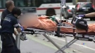Toronto paramedics transport a victim of an overdose to hospital on Sunday, July 30, 2017.