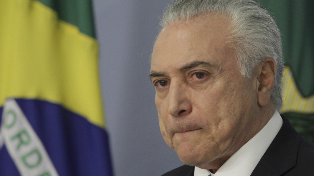 Brazil's president survives bribery vote