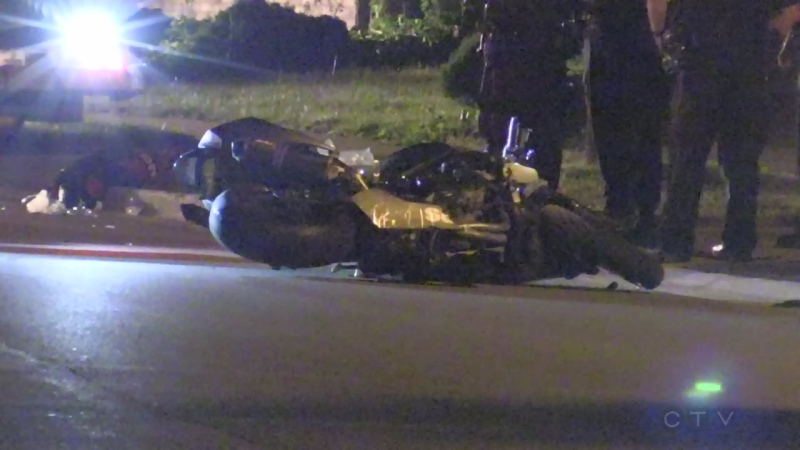 A motorcycle lays on the ground while police investigate a fatal crash on Wilkins Street on Sunday, August 6, 2017. (Jim Knight / CTV London)