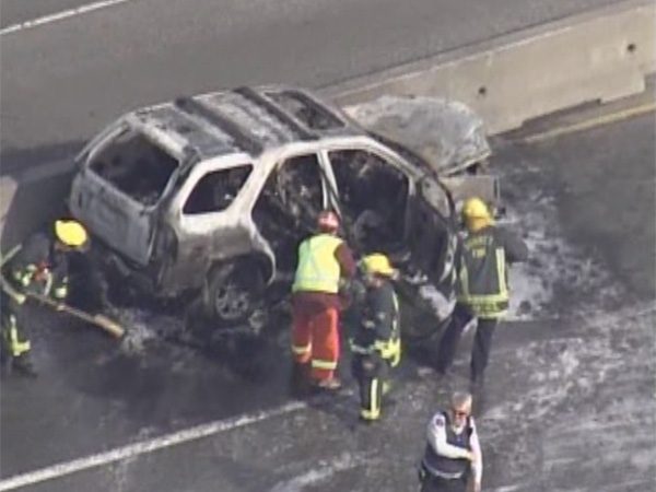 Fire crews deal with a car fire on the Port Mann bridge during rush hour on Monday, April 13. (CTV/Chopper 9)