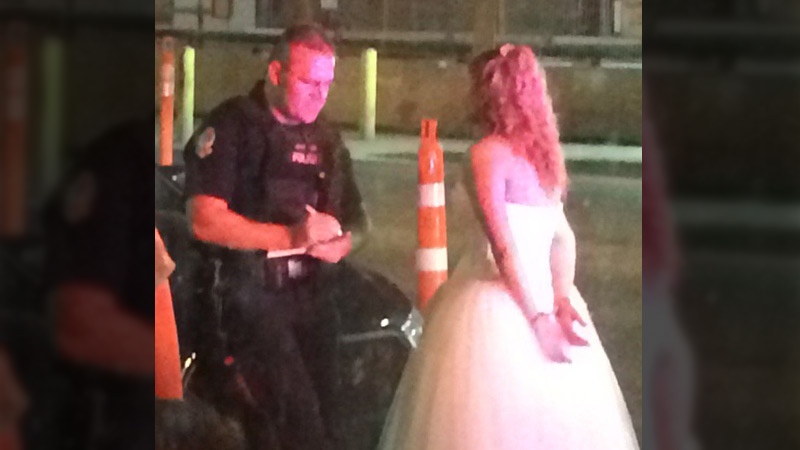 Photo of bride in handcuffs outside Edmonton bar going viral | CTV