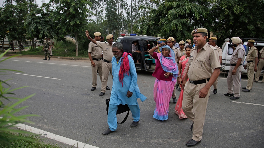 Indian policemen turn back passengers
