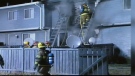 Calgary firefighters battle flames at a southeast Calgary home that was firebombed in 2004 