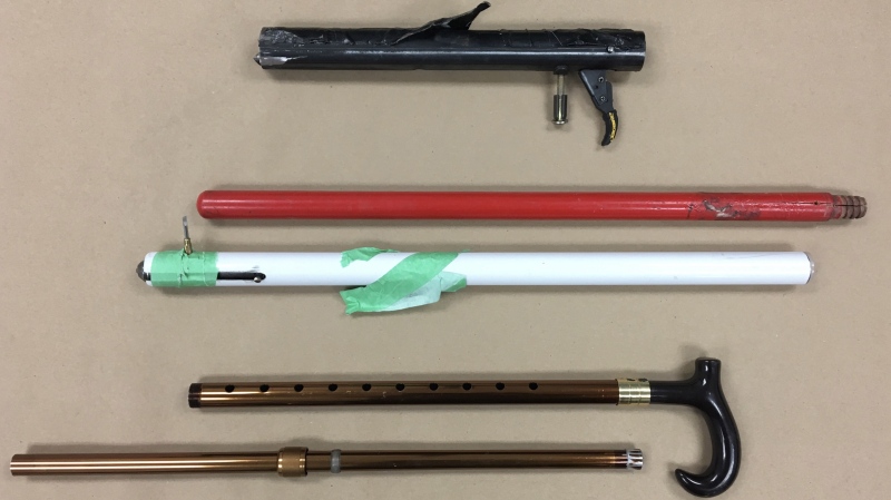 Upon arrival, crews discovered three firearms inside the house, including two “bang stick” style firearms, one of which was a brown cane with a spent .410 calibre round inside it, and a red and white broom stick with a live .22 calibre round ready to fire. (Source: Winnipeg Police Service)