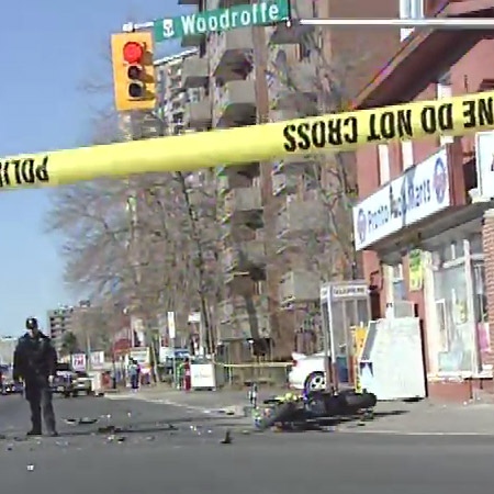 Police tape blocks off the intersection of Woodroffe Avenue and Richmond Road after a fatal motorcycle collision, Thursday, April 16, 2009.