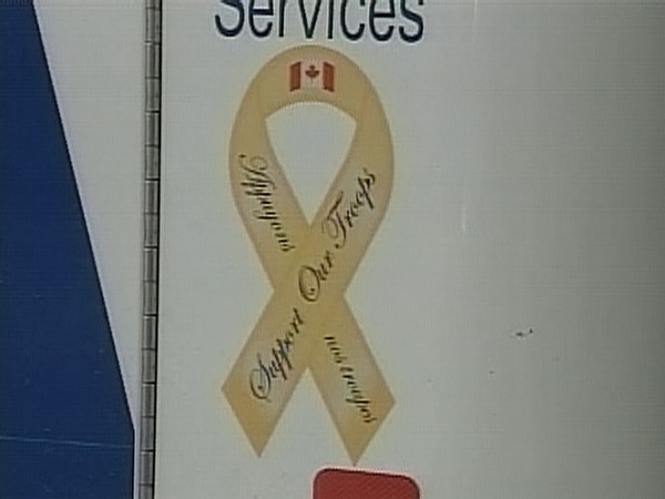 A 'Support Our Troops' ribbon is seen on the back of a Toronto Emergency Medical Services ambulance.