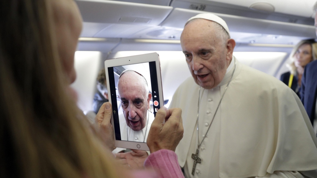 Pope Francis on board the flight to Bogota