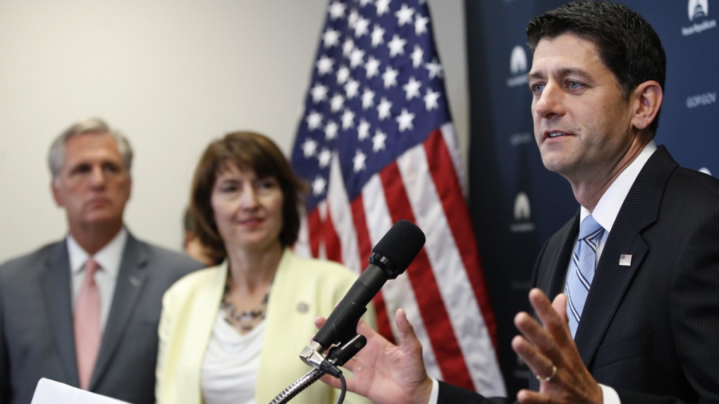 Paul Ryan, right, speaks on Capitol Hill