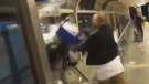A man is seen dumping a mop bucket of water onto a woman at Lawrence East station in this image from a video posted to Instagram on Sept. 6, 2017. (Torontorappers/Instagram)