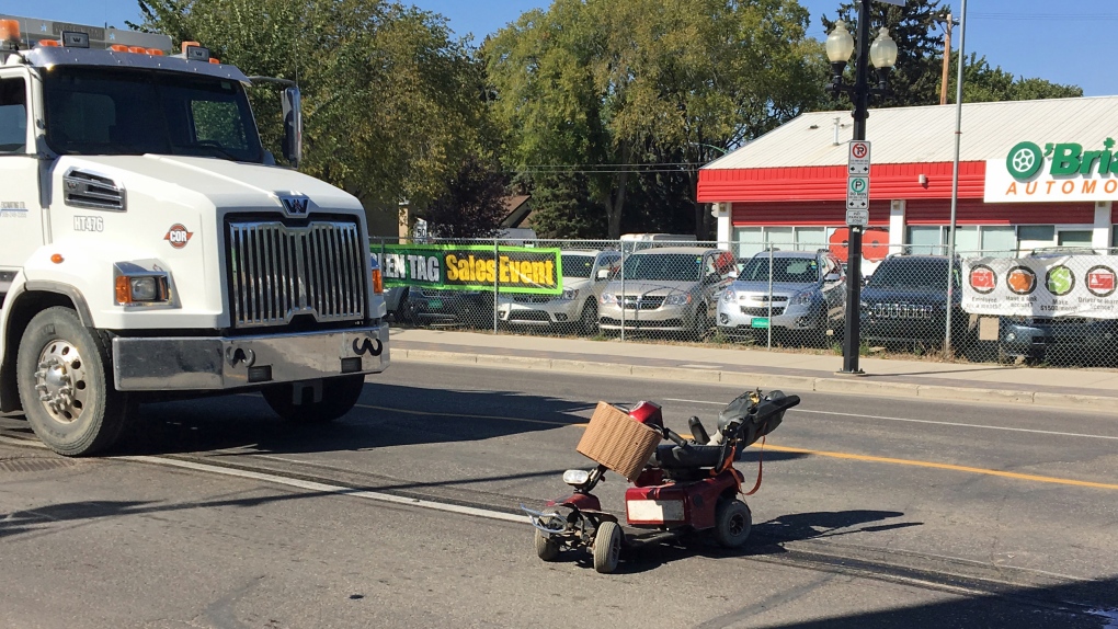 Scooter and gravel truck crash