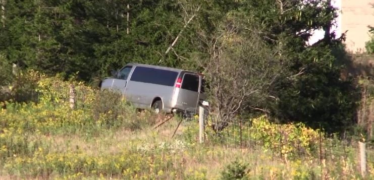 A van ends up in the ditch on Highway 401