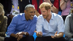 Former U.S. President Barack Obama and Prince Harry watch wheelchair basketball at the InvictusGames in Toronto on Friday, Sept. 29, 2017. THE CANADIAN PRESS / Chris Donovan