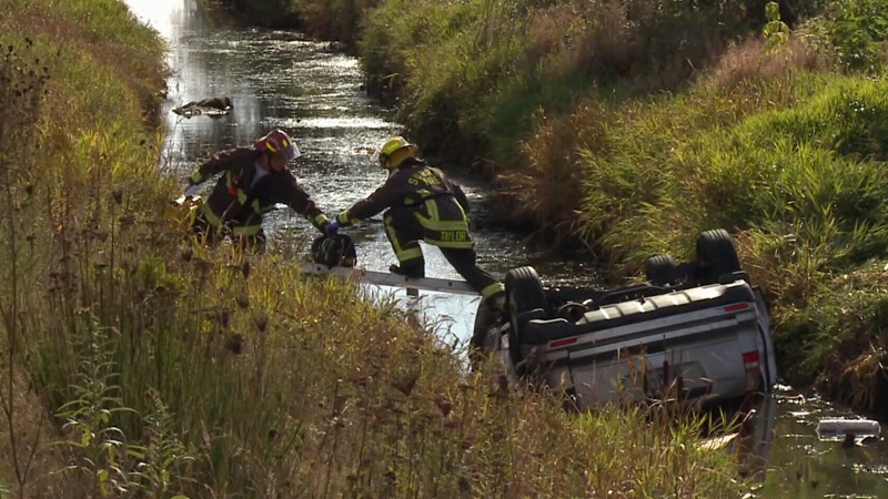 Family injured when SUV flips into water-filled di