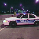An Ottawa police cruiser blocks off parts of Highway 417 after a police shooting near Walkley Road, Wednesday, April 22, 2009.